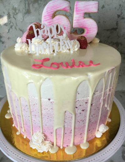 Raspberry Cake with raspberry ombre buttercream and white chocolate drip